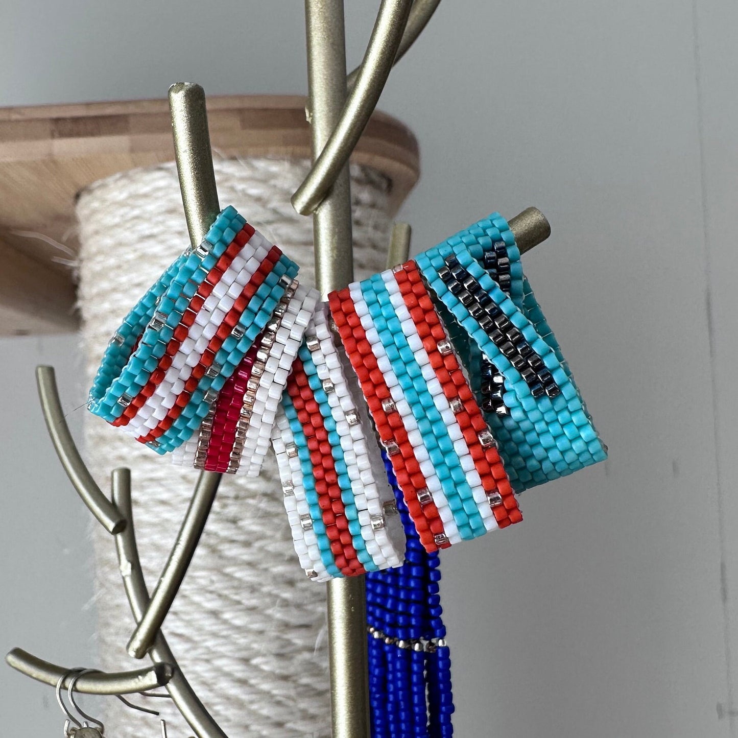 Red, White and Turquoise Blue Beaded Ring with Specs of Gold
